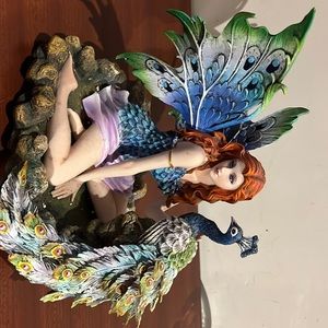 Fairy statue with peacock